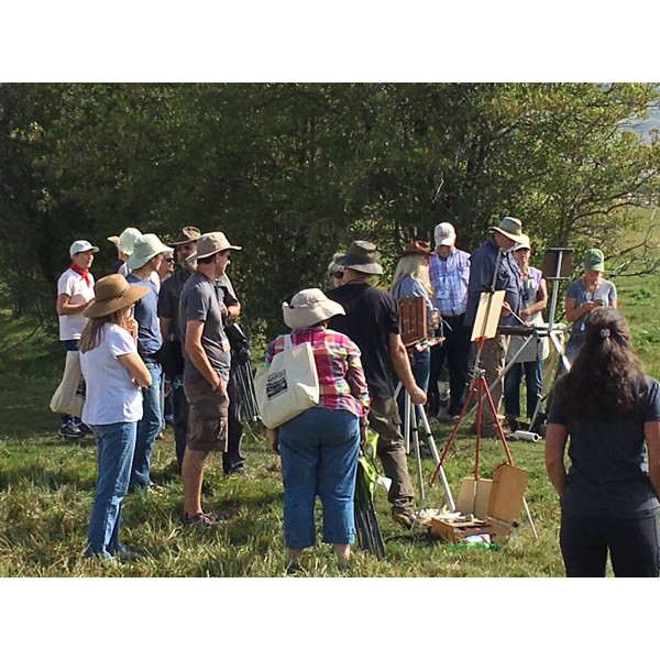 Rhett Ashby paints in th field